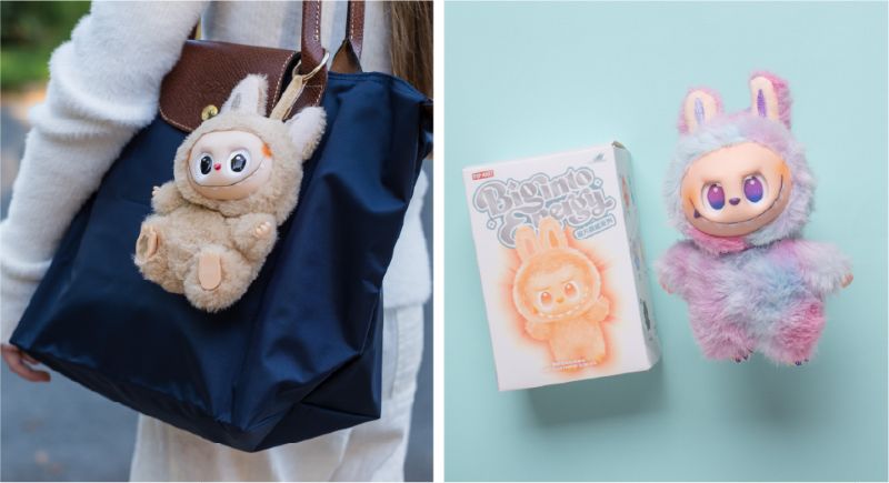 Labubu – Flair by Citti Deux figurines Labubu, petits personnages aux airs de lapin et de monstre, l’une accrochée à un sac bleu marine, l’autre présentée dans sa boîte sur fond pastel.